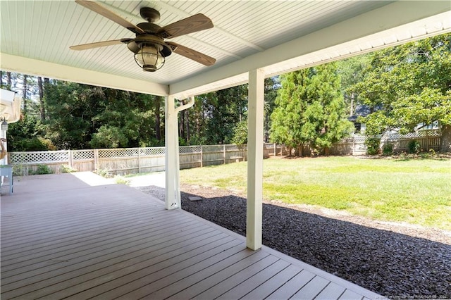 deck with ceiling fan and a lawn