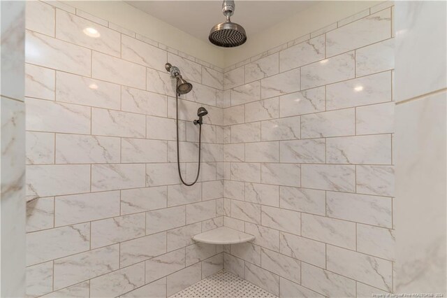 bathroom featuring tiled shower