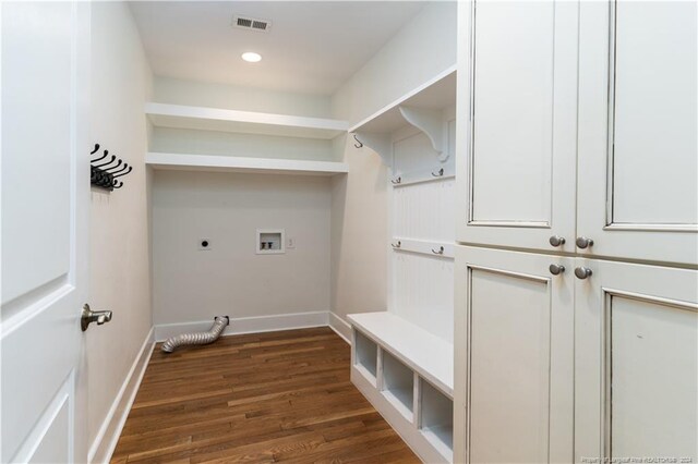 clothes washing area featuring washer hookup, dark hardwood / wood-style flooring, and electric dryer hookup