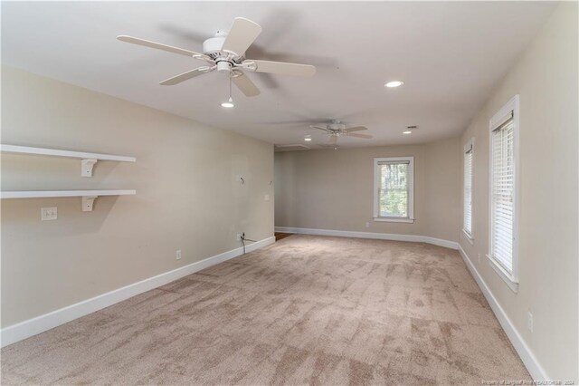 carpeted empty room with ceiling fan