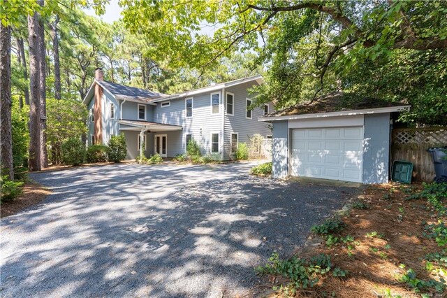 view of front of house featuring an outbuilding and a garage