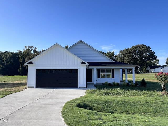 modern farmhouse style home with a garage and a front yard