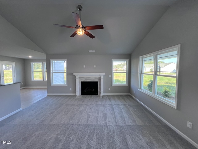 194 Lotus Ave, Smithfield, NC 27577 - unfurnished living room featuring vaulted ceiling, a ceiling fan, and plenty of natural light