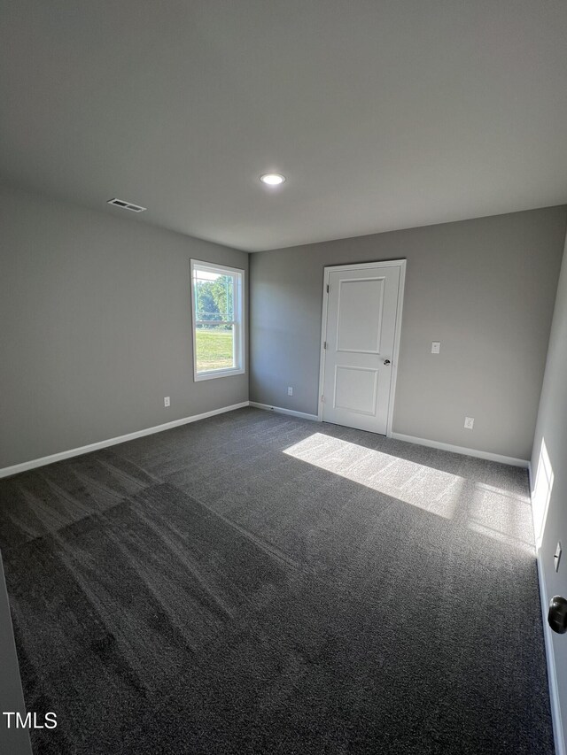 spare room with carpet floors