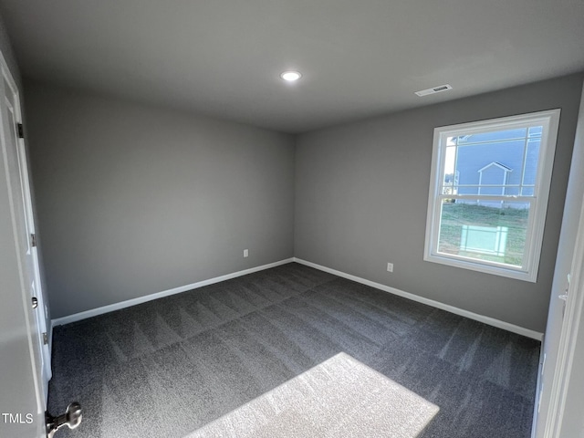 194 Lotus Ave, Smithfield, NC 27577 - interior space featuring recessed lighting, baseboards, dark colored carpet, and visible vents