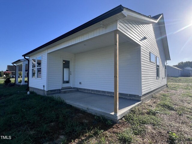 exterior space with a yard and a patio area