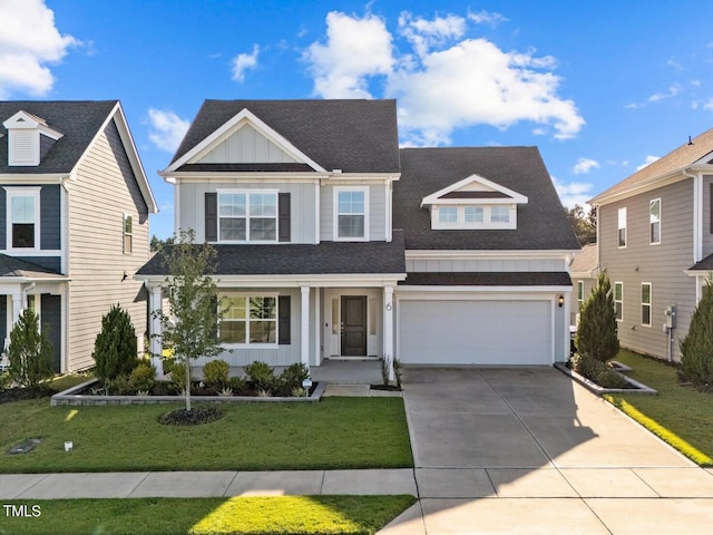 view of front of home featuring a front lawn and a garage