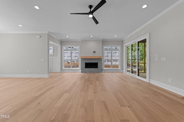 unfurnished living room with light wood-type flooring, crown molding, and ceiling fan