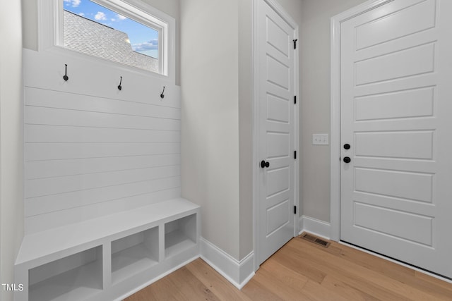 mudroom with light hardwood / wood-style flooring