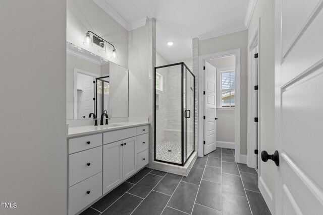 bathroom featuring vanity, tile patterned floors, an enclosed shower, and crown molding