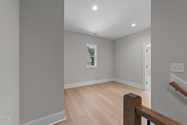 spare room with light wood-type flooring