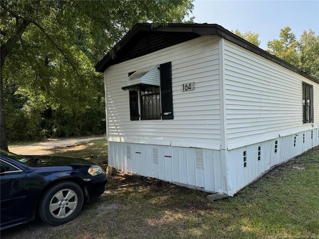 view of side of home featuring crawl space