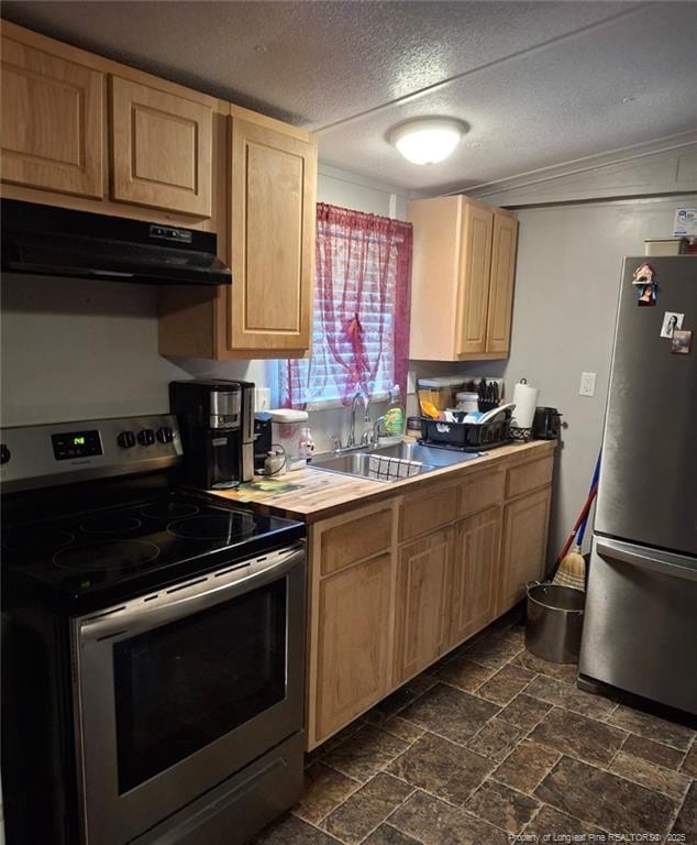 1644 Henry Berry Rd 1642, Rowland, NC 28383 - kitchen featuring stainless steel appliances, ventilation hood, light brown cabinets, dark stone finish flooring, and butcher block counters