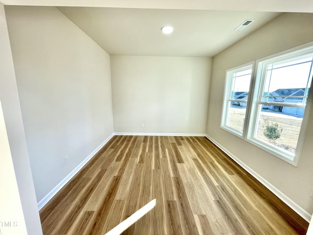 empty room featuring hardwood / wood-style floors