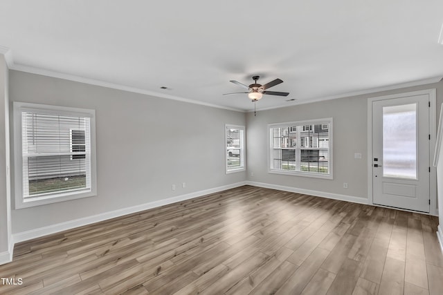 interior space with light hardwood / wood-style flooring, ceiling fan, and ornamental molding