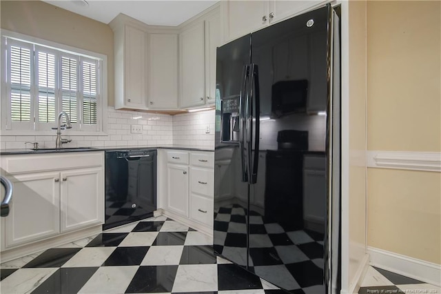 kitchen featuring decorative backsplash, sink, white cabinetry, and black appliances