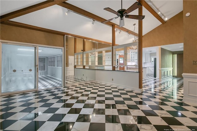 unfurnished living room featuring high vaulted ceiling, beamed ceiling, ceiling fan, and track lighting