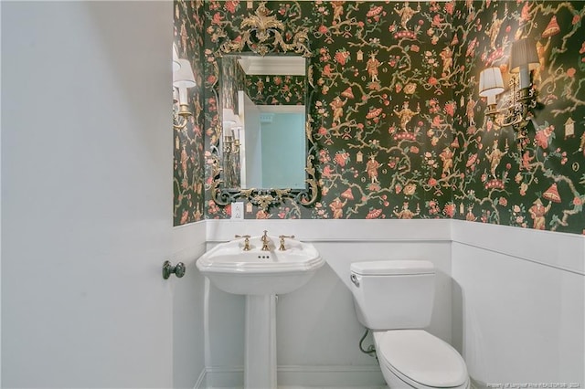 2116 Winterlochen Rd, Fayetteville, NC 28305 - half bath featuring wallpapered walls and toilet