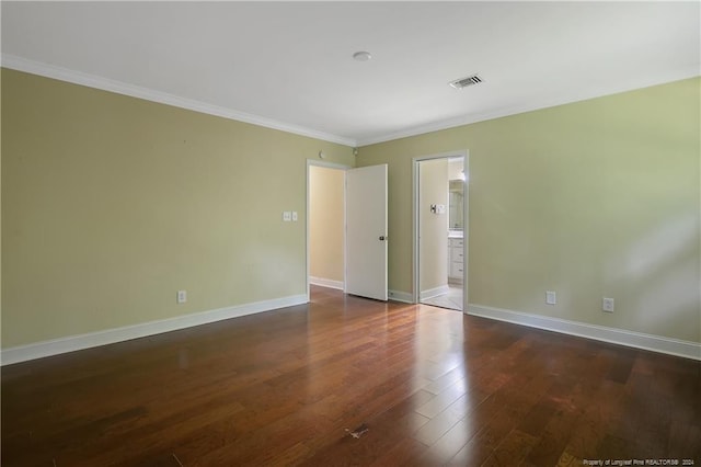 unfurnished room with dark wood-type flooring and crown molding