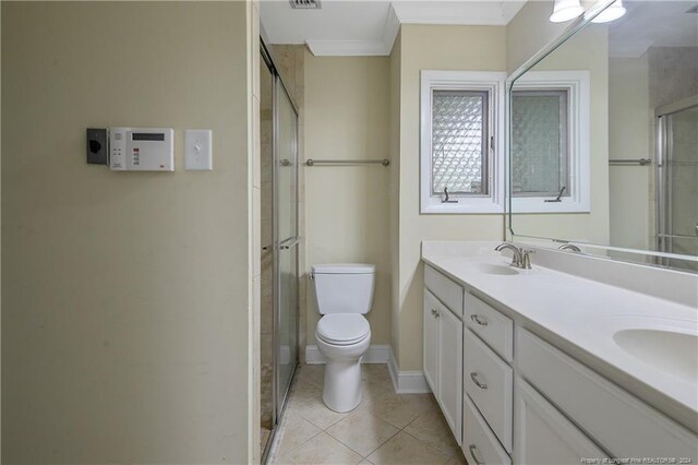 2116 Winterlochen Rd, Fayetteville, NC 28305 - full bathroom featuring a stall shower, tile patterned floors, toilet, a sink, and double vanity