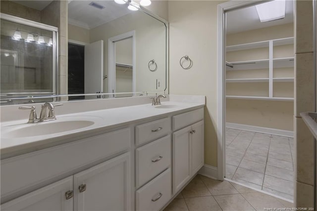 bathroom featuring tile patterned flooring and vanity