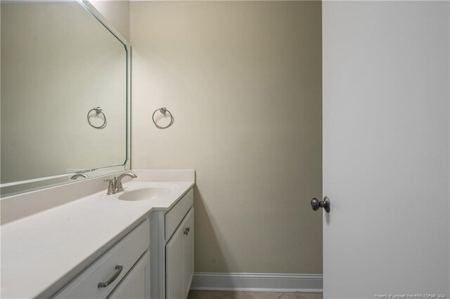 bathroom with tile patterned flooring and vanity