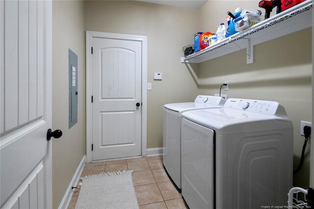 laundry room featuring light tile patterned flooring and separate washer and dryer