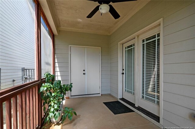 doorway to property with ceiling fan