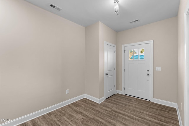 entrance foyer with dark hardwood / wood-style flooring