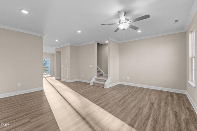 unfurnished living room featuring wood-type flooring, ceiling fan, and crown molding