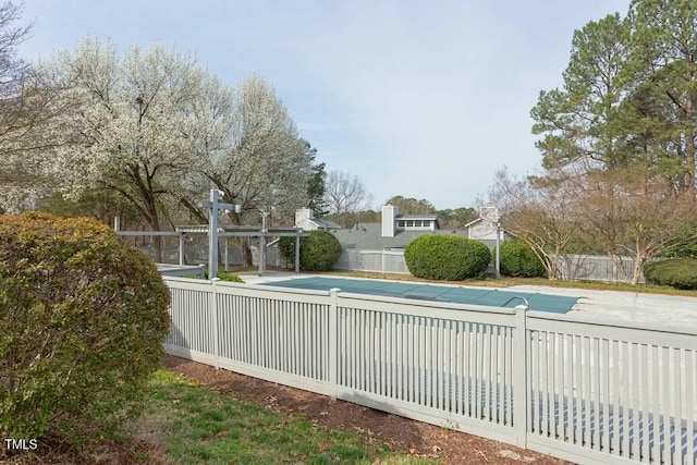 view of pool with a patio area, fence, and a fenced in pool