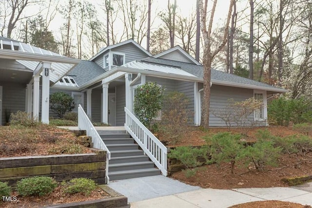 view of side of property featuring a porch