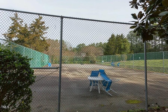 exterior space with community basketball court and fence