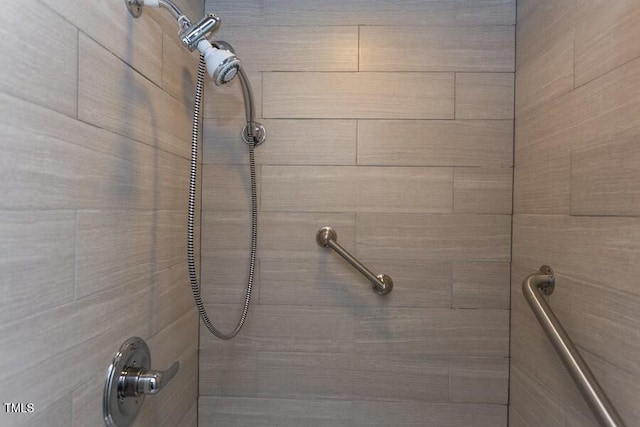 bathroom with tiled shower