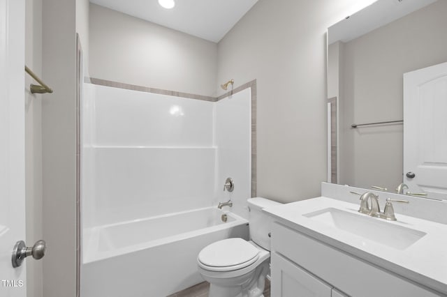 full bathroom featuring vanity, toilet, and  shower combination