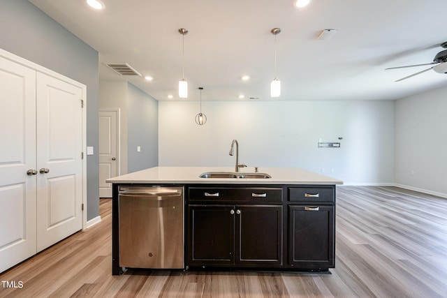 kitchen with a sink, light wood-type flooring, visible vents, and stainless steel dishwasher