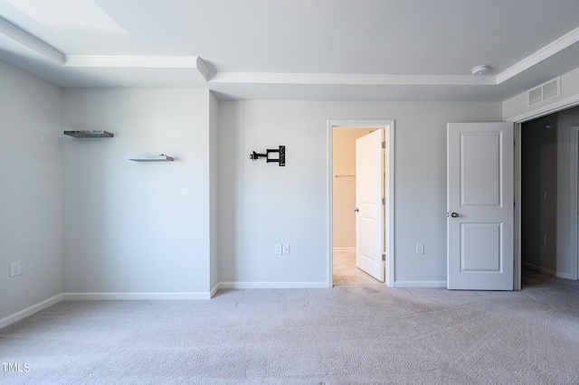 unfurnished bedroom featuring carpet, visible vents, and baseboards