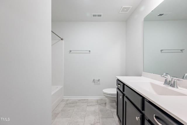 bathroom featuring toilet, visible vents, and vanity