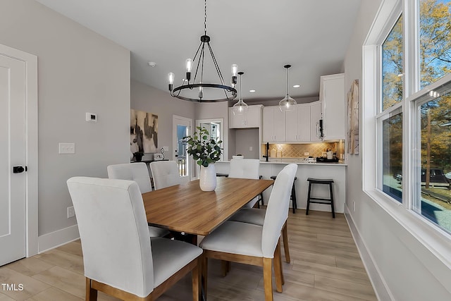 2401 E Main St, Durham, NC 27703 - dining space with a chandelier, recessed lighting, and light wood-style floors