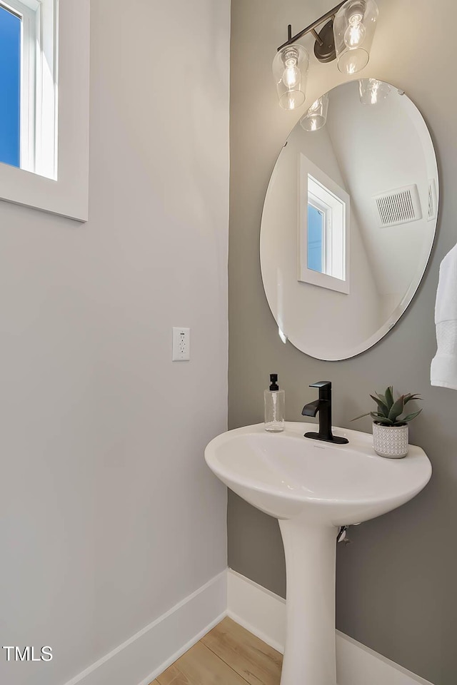 2401 E Main St, Durham, NC 27703 - bathroom with baseboards and wood finished floors