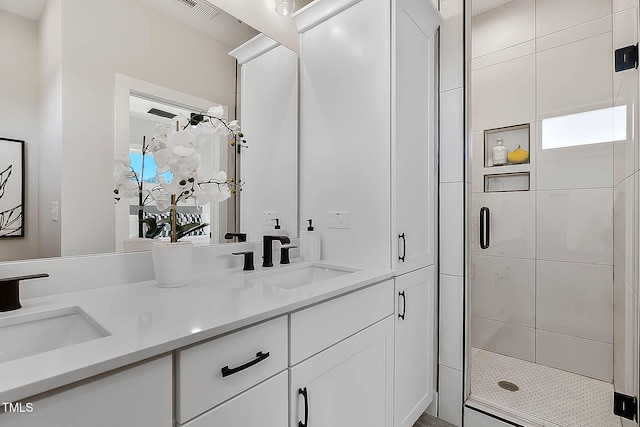 bathroom with vanity and an enclosed shower