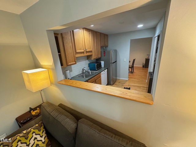 interior space featuring hardwood / wood-style flooring and sink