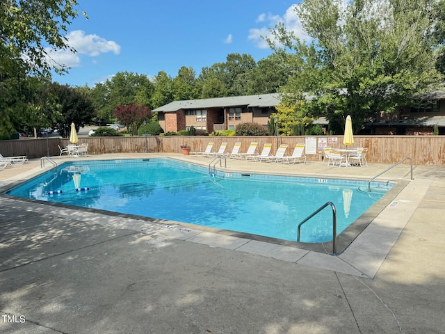 view of swimming pool with a patio area