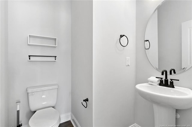 bathroom with sink and toilet