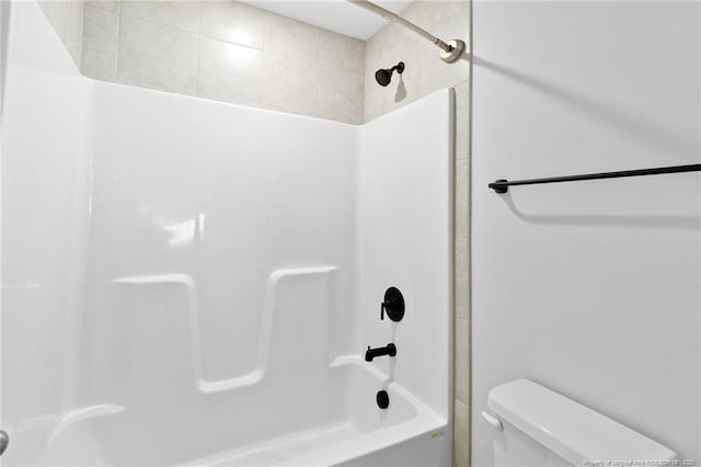 bathroom featuring  shower combination and toilet