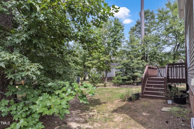 view of yard with a wooden deck