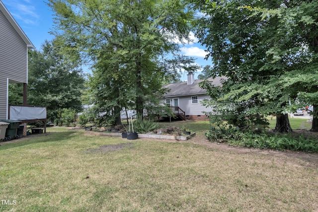 view of yard featuring a wooden deck