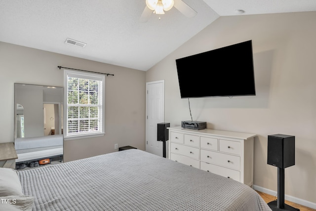 bedroom featuring lofted ceiling and ceiling fan