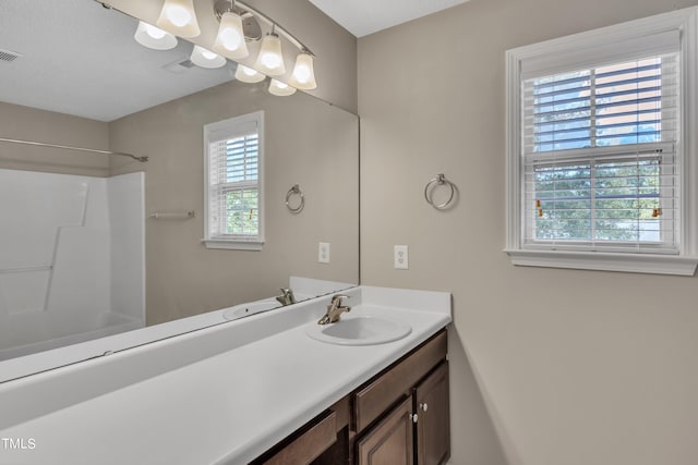 bathroom featuring bathing tub / shower combination and vanity