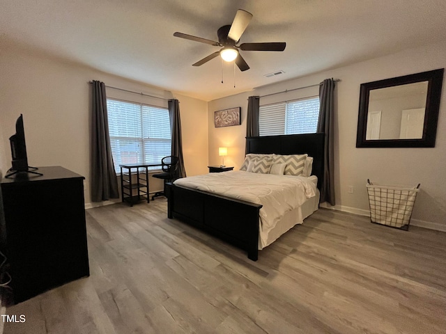 bedroom featuring ceiling fan and light wood-type flooring